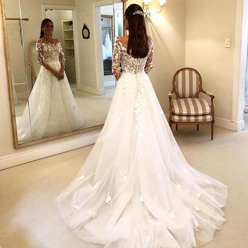 http://www.ballbella.com/cdn/shop/files/off-the-shoulder-long-sleeves-mermaid-lace-wedding-dress-wedding-dress-3_1024x.jpg?v=1701982242