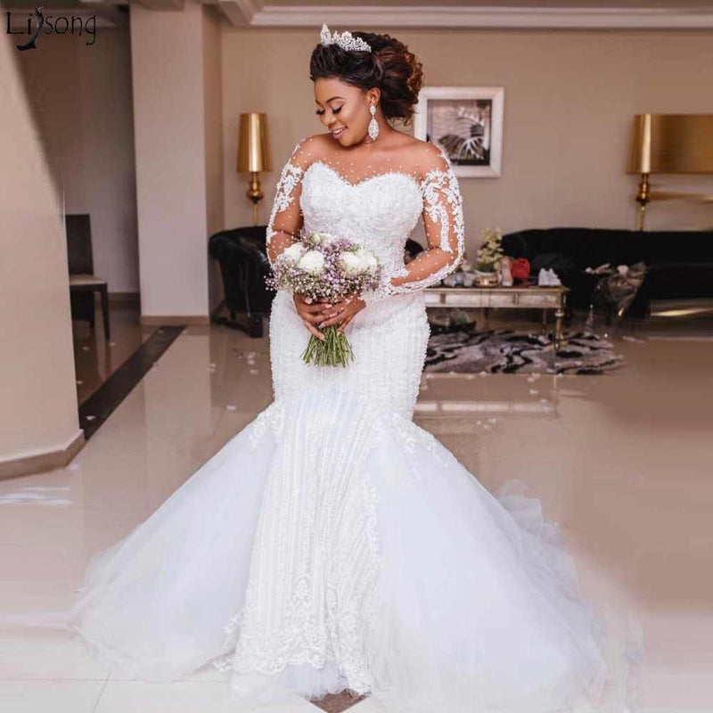 https://www.ballbella.com/cdn/shop/files/long-sleeves-appliques-sheer-tulle-mermaid-lace-wedding-dresses-bridal-gowns-wedding-dress-2_800x.jpg?v=1701888150